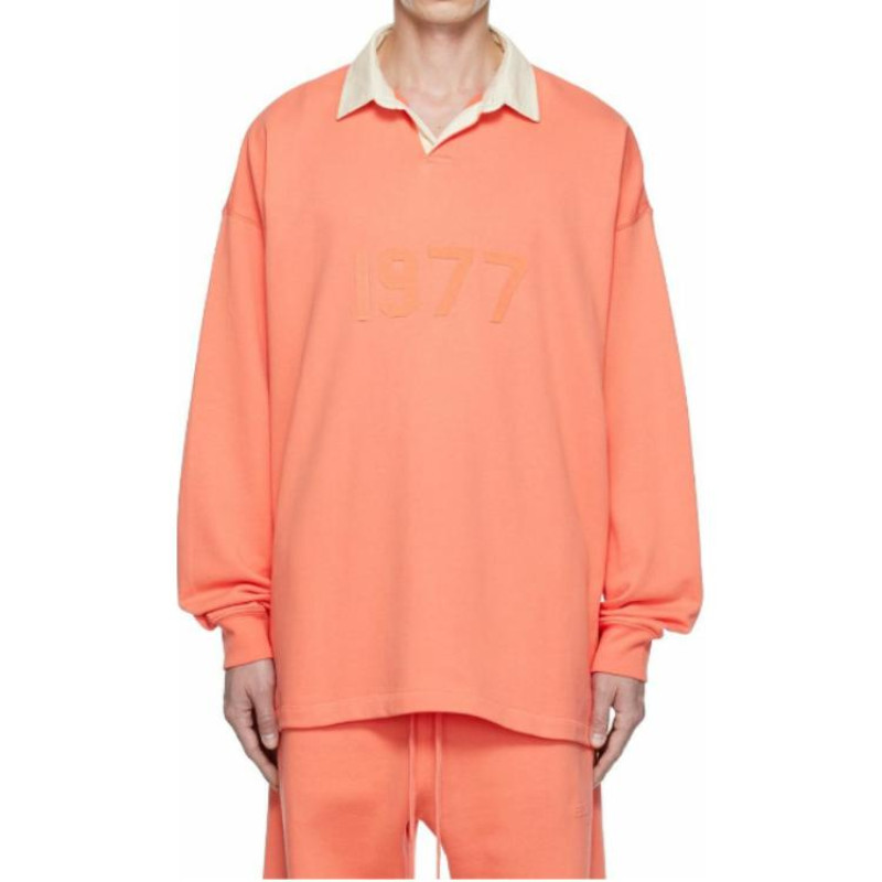 Fear of God Essentials FW22 1977 Henley Rugby in Coral Polo